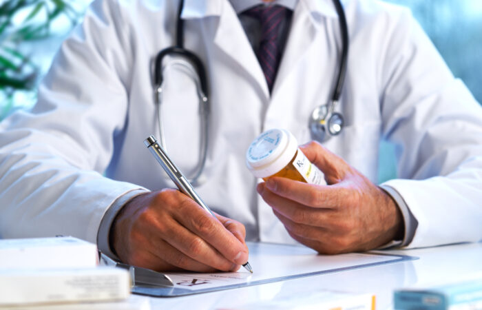 Doctors writing on paper