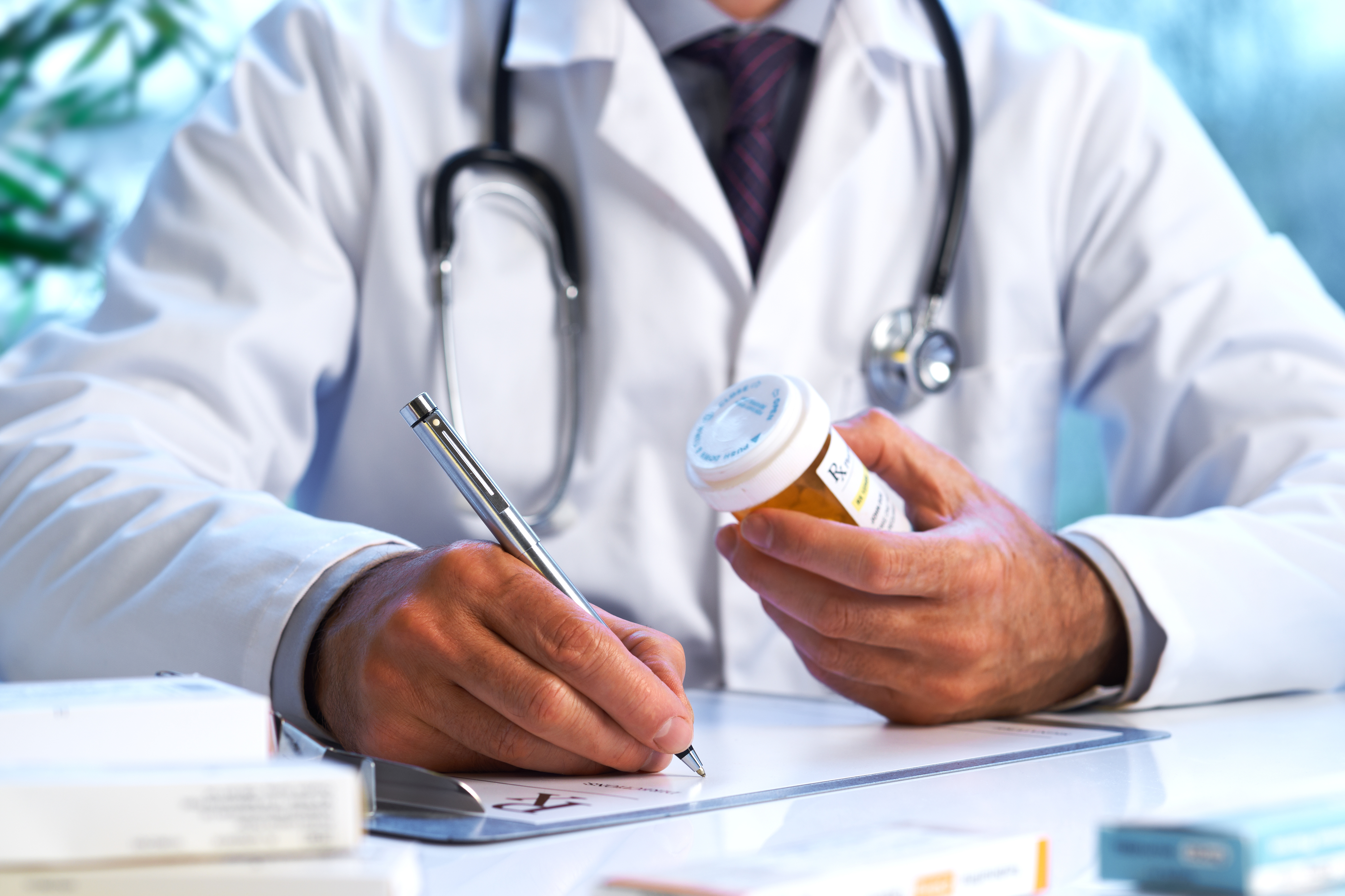 Doctors writing on paper